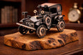 Metal vintage car olive wood sculpture displayed as an artistic accent on a rustic wooden shelf.