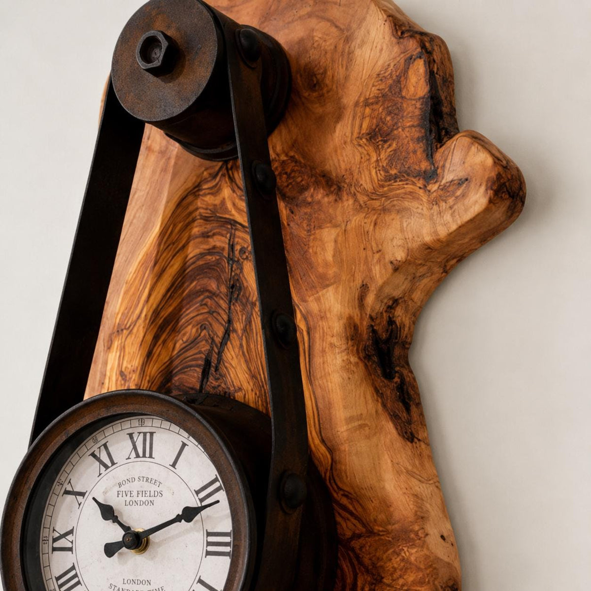 Side angle showing solid wood thickness of an olive wood rustic hanging timepiece clock. | Olive Wood Rustic Hanging Timepiece Wall Clock - Olivaryn
