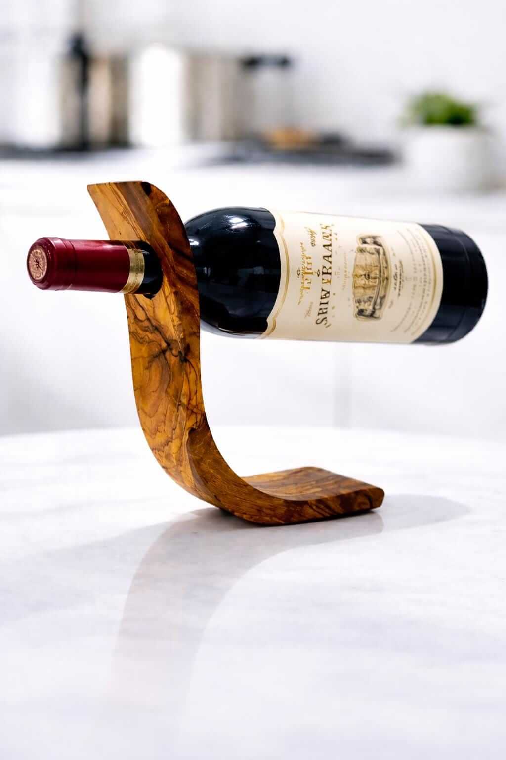 Floating olive wood wine bottle stand showcasing a wine bottle in a stylish, handcrafted holder.