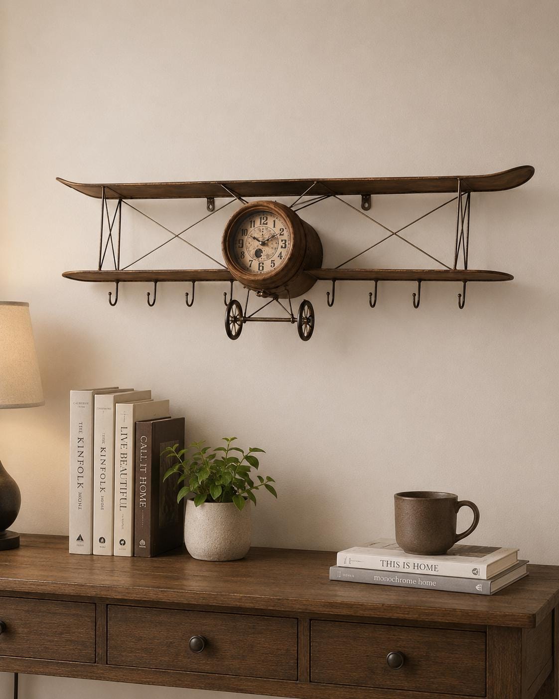 Home office wall decor styled with an artisan vintage airplane olive wood wall clock.