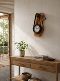 Living room wall decor featuring a rustic olive wood hanging timepiece clock. | Olive Wood Rustic Hanging Timepiece Clock | Olive Wood Rustic Hanging Timepiece Wall Clock - Olivaryn