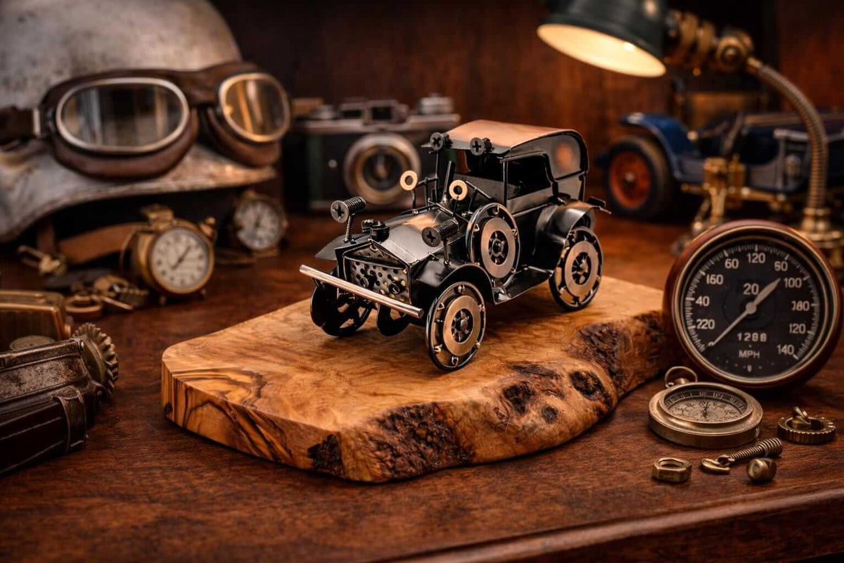 Vintage automotive decor piece featuring a metal vintage car olive wood sculpture on a study desk.