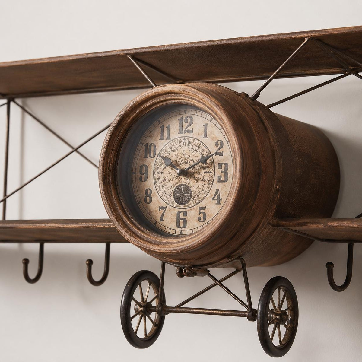 Close up of the propeller clock dial and wings on a vintage airplane olive wood wall clock.