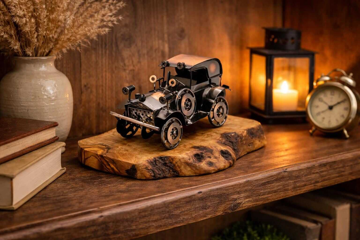 Rustic home office decor featuring a collectible metal vintage car olive wood sculpture.